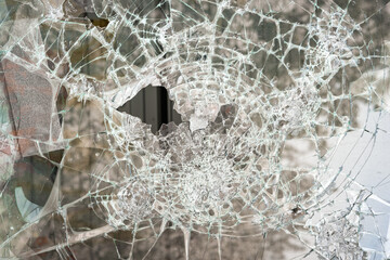 a broken window, a lot of cracks on the glass