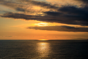 Fototapeta premium seascape at sunset, clouds in the sky and the sea