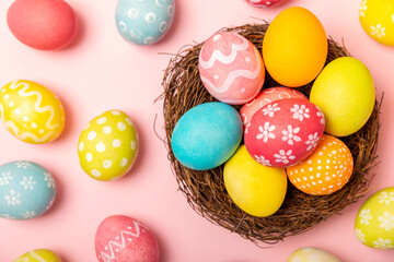 Easter eggs on a bright pink background. Easter celebration concept. Colorful easter handmade...