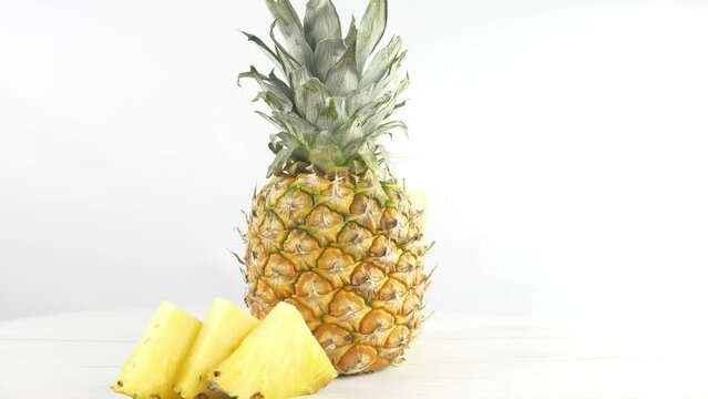 A pineapple. Juicy and ripe. With slices and berries and fruits