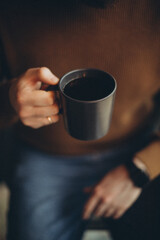 person holding a cup of coffee