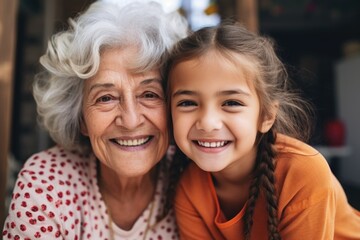 A joyful moment captured between an older woman and a young girl. Suitable for family, happiness, and generations themes