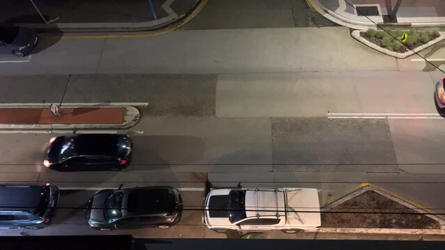 Panoramic Aerial Video Drone view of cars driving at night through a Suburban Sydney street NSW Australia