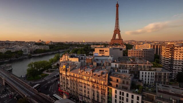 PARIS, FRANCE - FEBRUARY 20, 2024 : Timelapse rooftop street view of the Eiffel Tower and Champ de Mars above the historical city center, famous touristic landmark.