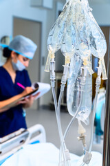 Intravenous IV Drip and Nurse on Background in ICU - 745202820