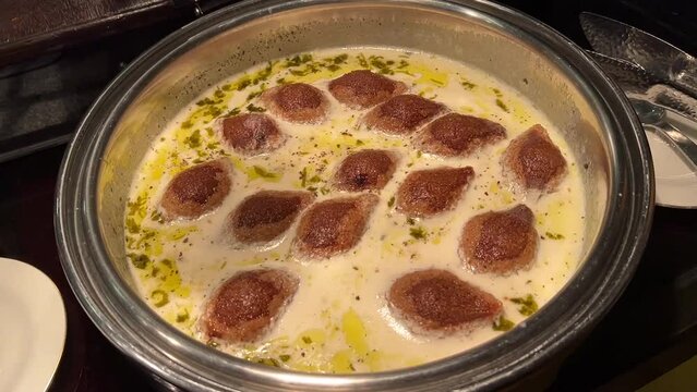 Kibbeh with labneh in a silver plate