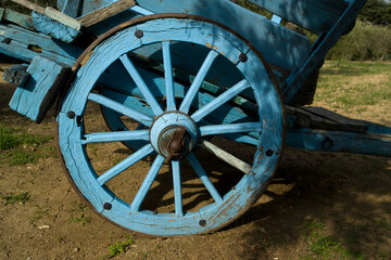 Fototapeta na wymiar old farm wagonwheel Old animal-drawn wagon. Oliena (Nu) Sardinia. Italy