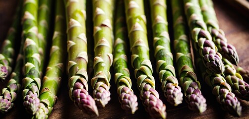 a close up of a bunch of asparagus on a table with other asparagus in the background.