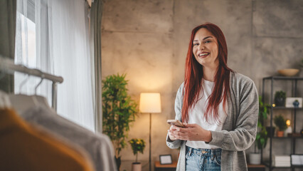 young woman at home use mobile phone sms texting or browse internet