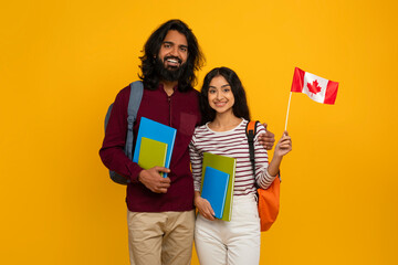 Cheerful indian man and woman choosing education abroad