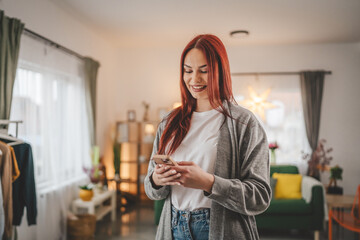 young woman at home use mobile phone sms texting or browse internet