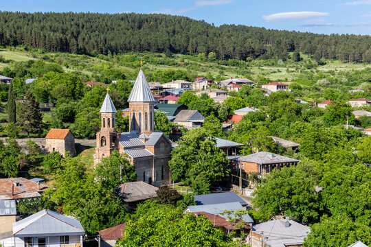 Landscape of Surami, small town (daba) in Georgia, Shida Kartli region with rural architecture and Surami St. George, Armenian orthodox church.