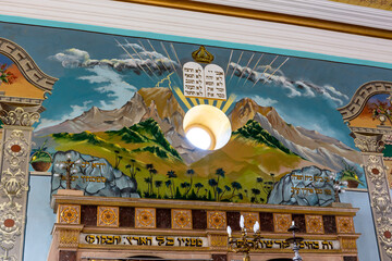 Kutaisi Synagogue altar wall richly decorated with painting of Mount Sinai and the Decalogue with...