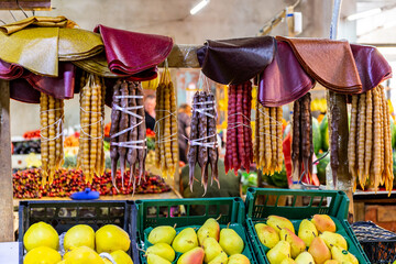 Market stall in Kutaisi Central Market (Green Bazaar,  Mtsvane Bazari) with churchkhela,...