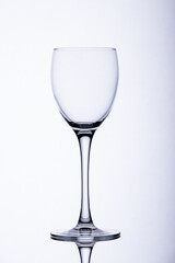 Empty wine glass on white background.