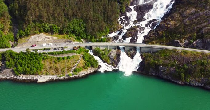 Aerial panning view footage , waterfall flowing down mountain side. Tourism in Iceland. Inspiration in nature. 