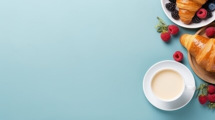 Obraz na płótnie Canvas Elegant breakfast spread on blue background