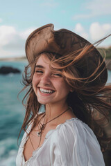 A young, smiling woman pirate in a hat, against an ocean backdrop, with windswept hair