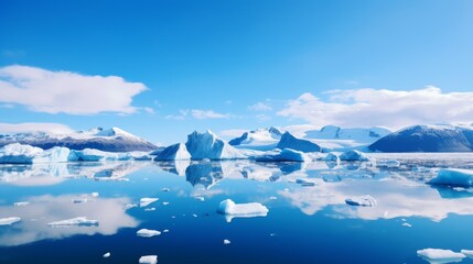 Fototapeta na wymiar Icebergs reflecting in calm sea water 