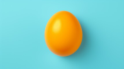 Minimalist orange egg yolk on blue background - obrazy, fototapety, plakaty