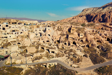 View of ancient cave houses of small town Çavuşin. Nevşehir Province, Cappadocia, Turkey