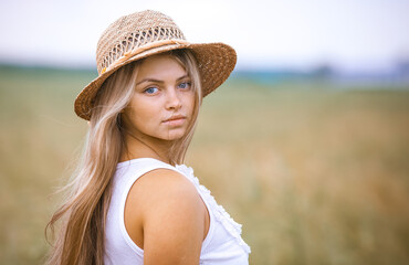 Portrait Happy Girl in a Wheat Field