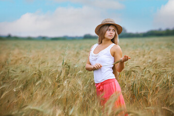 Happy Girl in a Wheat Field - 745237289