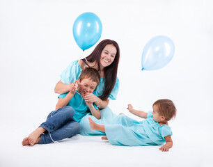 Happy mother with children on a light background - 745237635