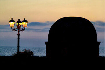 Sunset on the ramparts in Alghero, detail of one of the turrets. SS, Sardinia. Italy