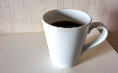 White coffee cup with filter coffee on a table Thailand.