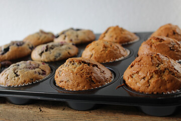 Sweet Chocolate and Berry Muffins still in their Baking Cups