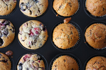 Sweet Chocolate and Berry Muffins still in their Baking Cups