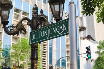 a tunjungan street signboard. a famous street in surabaya. surabaya, indonesia - 21 february 2024