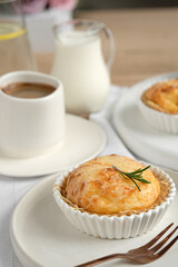 Baking tart pie portioned with a cup of coffee on the table