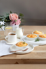 Baking tart pie portioned with a cup of coffee on the table