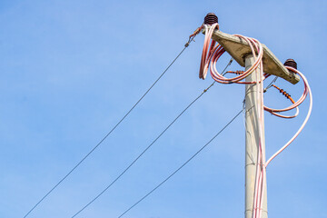 High voltage power line. Electric pole and cables.