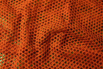 orangener Netz Stoff als Hintergrund