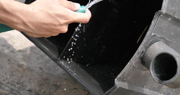 Man cleaning a grease trap, grease trap cleaning, Grease traps box in the house