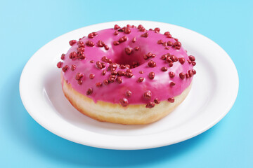 Pink donut in plate