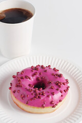 Pink donut and coffee