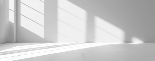 Fototapeta premium Modern minimalistic white room with sharp light and shadow play, suitable as a background for design projects or as art in a tranquil setting.