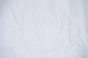 Close-up of a crumpled white paper texture, suitable for backgrounds and abstract designs.