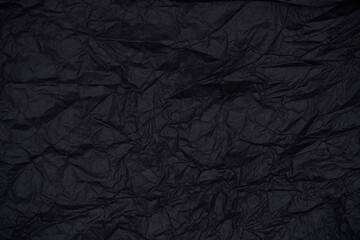 High-resolution image of torn black paper, ideal for creative background and texture overlays.