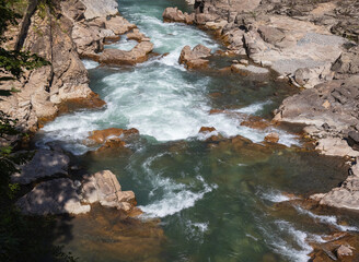 Morning on a mountain river, awakening in nature summer sunny mood.