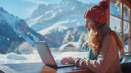 Fotobehang Young woman freelancer working on laptop and enjoying the beautiful nature landscape with mountain viewGenerative AI © ZzGooggiigz
