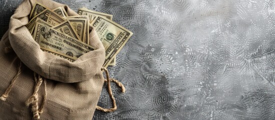 Portrait out of Sack with dollar paper banknotes on gray background. copy space - obrazy, fototapety, plakaty