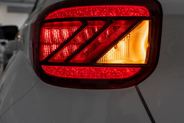 Rear running lights of passenger car close-up