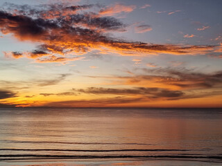 Beautiful clouds in the sky with sea before sunrise on the beach in the morning time