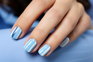 Womans Hand With Blue and White Manicure