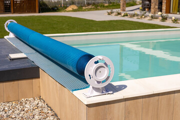 Swimming pool cover for protection against dirt, leaves, heating and cooling water, copy space....